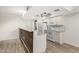 Bright kitchen features white appliances, a wood-clad breakfast bar, and lovely granite countertops at 234 N 75Th St # 209, Mesa, AZ 85207