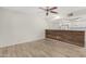 Open living room showcasing modern flooring, and bar overlooking the kitchen at 234 N 75Th St # 209, Mesa, AZ 85207