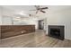 Open living room with fireplace and bar top with view of the kitchen at 234 N 75Th St # 209, Mesa, AZ 85207