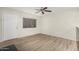 Bright living room featuring modern ceiling fan, window, and light wood-look flooring at 234 N 75Th St # 209, Mesa, AZ 85207