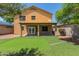 Backyard featuring a putting green, covered patio, rocks, and view of the second story at 24813 W Rosita Ave, Buckeye, AZ 85326