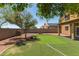 Backyard features a putting green, rock decorations, and is perfect for entertaining at 24813 W Rosita Ave, Buckeye, AZ 85326