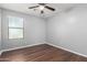 Clean bedroom offering a ceiling fan, light and large window for brightness and comfort at 24813 W Rosita Ave, Buckeye, AZ 85326
