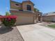 Well-maintained home with desert landscaping features a wide driveway and inviting entrance at 24813 W Rosita Ave, Buckeye, AZ 85326