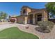 Charming two-story home features a well-manicured landscape and covered entryway at 24813 W Rosita Ave, Buckeye, AZ 85326