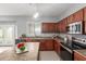 Bright kitchen with island seating, stainless appliances, and stylish countertops at 24813 W Rosita Ave, Buckeye, AZ 85326