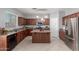 Spacious kitchen features a central island, modern appliances, and ample cabinet space at 24813 W Rosita Ave, Buckeye, AZ 85326
