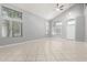 Spacious living room with vaulted ceiling, arched windows, and ample natural light at 24813 W Rosita Ave, Buckeye, AZ 85326