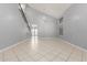Spacious living room with soaring ceilings, tile flooring, and natural light at 24813 W Rosita Ave, Buckeye, AZ 85326