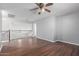 Spacious loft area with hardwood floors and a ceiling fan at 24813 W Rosita Ave, Buckeye, AZ 85326