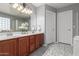 Bathroom featuring dual sinks, a soaking tub, and a separate glass shower at 24813 W Rosita Ave, Buckeye, AZ 85326