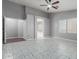 Large main bedroom with tile flooring and a view to the attached bath at 24813 W Rosita Ave, Buckeye, AZ 85326