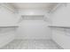 Walk-in closet with shelving and tile flooring at 24813 W Rosita Ave, Buckeye, AZ 85326