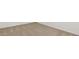 Close-up of neutral-toned carpet with clean, bright white baseboards at 25165 N 183Rd Dr, Wittmann, AZ 85361