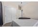 Bedroom with neutral colors, a ceiling fan, and closet access at 25447 W Heathermoor Dr, Buckeye, AZ 85326