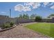 Backyard featuring artificial grass, gravel landscaping, and a block wall for privacy at 25930 N 165Th Ln, Surprise, AZ 85387
