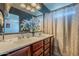 This bathroom features a double sink vanity, a shower, and a neutral color scheme at 25930 N 165Th Ln, Surprise, AZ 85387
