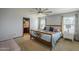 A spacious bedroom with ensuite bathroom, large windows, lots of natural light, and neutral walls at 25930 N 165Th Ln, Surprise, AZ 85387
