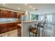 Beautiful kitchen features counter seating and stainless steel appliances at 25930 N 165Th Ln, Surprise, AZ 85387
