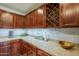 This kitchen has beautiful wood cabinets, granite countertops and an upper wine rack at 25930 N 165Th Ln, Surprise, AZ 85387