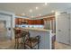 Open kitchen featuring a breakfast bar and stainless steel refrigerator at 25930 N 165Th Ln, Surprise, AZ 85387