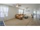 Bright living room boasts large windows and ample seating with two sofas at 25930 N 165Th Ln, Surprise, AZ 85387