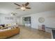 Spacious living room features a ceiling fan and modern furnishings at 25930 N 165Th Ln, Surprise, AZ 85387