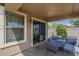 Covered patio with a light gray sofa set and a coffee table at 25930 N 165Th Ln, Surprise, AZ 85387