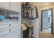 This organized walk-in closet with white cabinets and mirror provides ample storage at 25930 N 165Th Ln, Surprise, AZ 85387