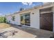 A relaxing back patio with a sliding glass door, perfect for outdoor enjoyment and entertaining at 3202 W Glenrosa Ave, Phoenix, AZ 85017