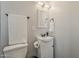 Bathroom boasts a modern vanity, white towel set, and sleek hardware for a clean, minimalist aesthetic at 3202 W Glenrosa Ave, Phoenix, AZ 85017