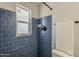 Bathroom with blue tiles in the shower at 3202 W Glenrosa Ave, Phoenix, AZ 85017