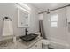Remodeled bathroom featuring a modern vanity, sleek black fixtures, and updated subway tile in shower at 3202 W Glenrosa Ave, Phoenix, AZ 85017