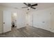Cozy bedroom with a ceiling fan, closet and ensuite bathroom at 3202 W Glenrosa Ave, Phoenix, AZ 85017