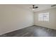 This bedroom has a modern ceiling fan, neutral walls and flooring and a window with privacy blinds at 3202 W Glenrosa Ave, Phoenix, AZ 85017