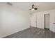 Clean bedroom with modern ceiling fan, fresh white walls and wood-look flooring plus access to large closet at 3202 W Glenrosa Ave, Phoenix, AZ 85017