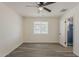 Bedroom featuring a ceiling fan, light-filled window, and en-suite bathroom at 3202 W Glenrosa Ave, Phoenix, AZ 85017