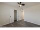 Fresh bedroom with ceiling fan, modern floors and neutral paint plus a closet with shelving at 3202 W Glenrosa Ave, Phoenix, AZ 85017