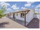 Home exterior showcasing a long covered porch with supporting beams and desert landscaping at 3202 W Glenrosa Ave, Phoenix, AZ 85017