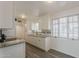 Updated kitchen featuring white cabinets, granite countertops and stainless steel appliances at 3202 W Glenrosa Ave, Phoenix, AZ 85017
