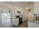 Bright kitchen featuring white cabinetry, granite countertops, and stainless steel appliances at 3202 W Glenrosa Ave, Phoenix, AZ 85017