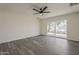 Bright living room with wood floors and sliding glass door to the backyard at 3202 W Glenrosa Ave, Phoenix, AZ 85017