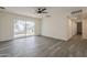 Large living room with sliding glass doors and grey wood flooring at 3202 W Glenrosa Ave, Phoenix, AZ 85017
