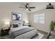 Bedroom showcasing neutral colors, comfortable bed, and a ceiling fan at 3202 W Glenrosa Ave, Phoenix, AZ 85017
