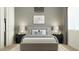 A serene bedroom featuring a well-made bed and complementary decor and window at 32452 N Cherry St, San Tan Valley, AZ 85143