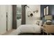 A stylish bedroom featuring warm lighting, modern decor, and a baseball theme at 32452 N Cherry St, San Tan Valley, AZ 85143