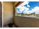Balcony view with a tan stucco railing offers scenic views and natural light at 3434 E Baseline Rd # 216, Phoenix, AZ 85042