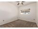 Carpeted bedroom with neutral walls and a window that provides plenty of natural light at 3434 E Baseline Rd # 216, Phoenix, AZ 85042