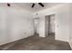 Carpeted bedroom with ceiling fan and closet doors leading to storage space at 3434 E Baseline Rd # 216, Phoenix, AZ 85042