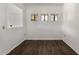 Dining area featuring wood floors and natural light from three windows at 3434 E Baseline Rd # 216, Phoenix, AZ 85042